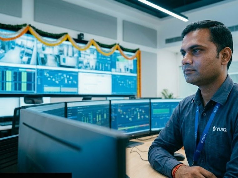 YUGA engineer at AI monitoring screens